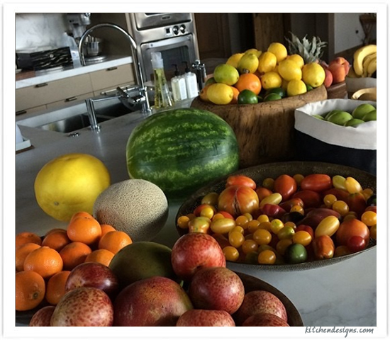 kitchen photo with dough bowls filled with fruits and vegetables