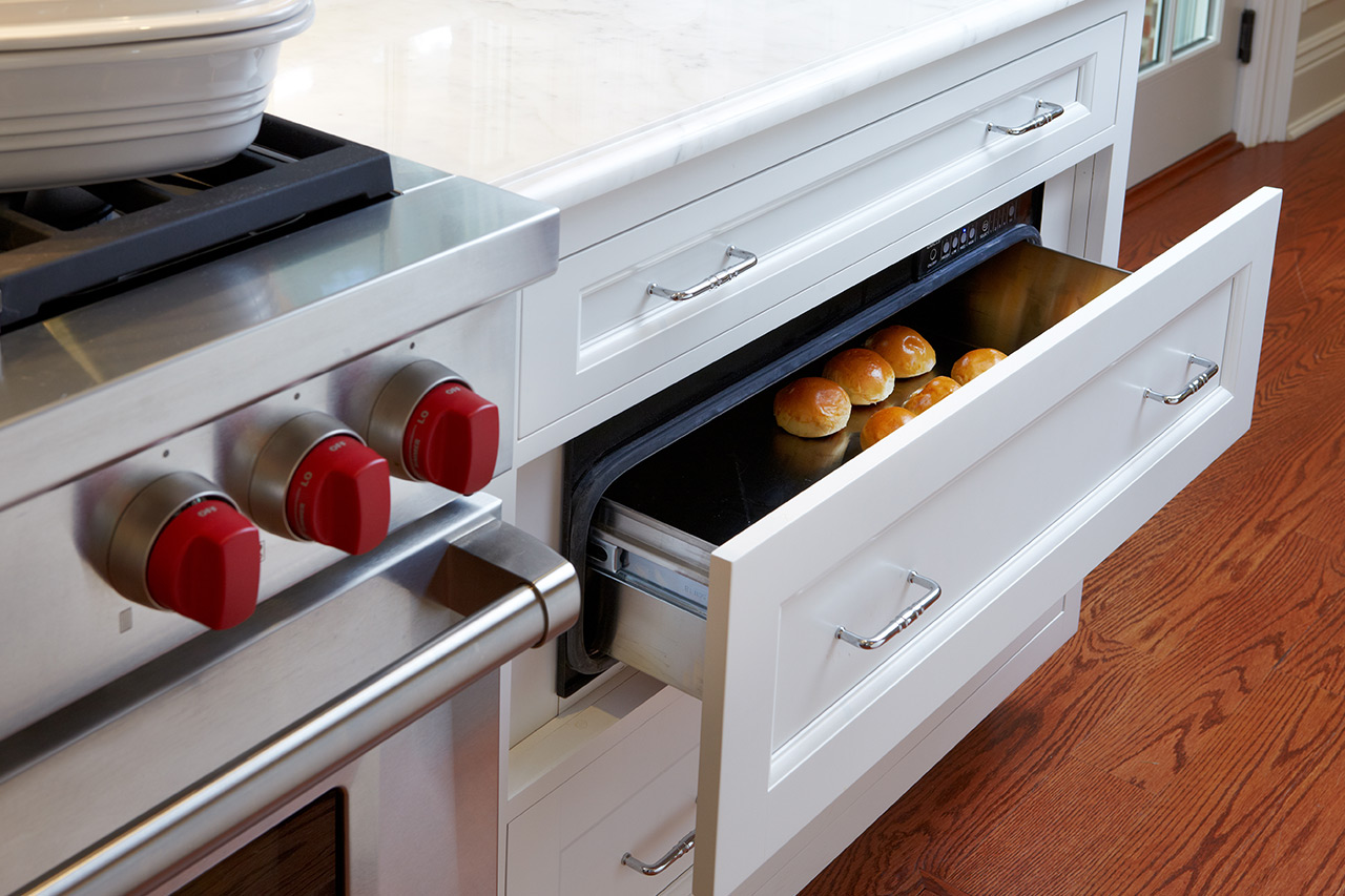 White Kitchen Cabinet - Opened Integrated Warming Drawer panel