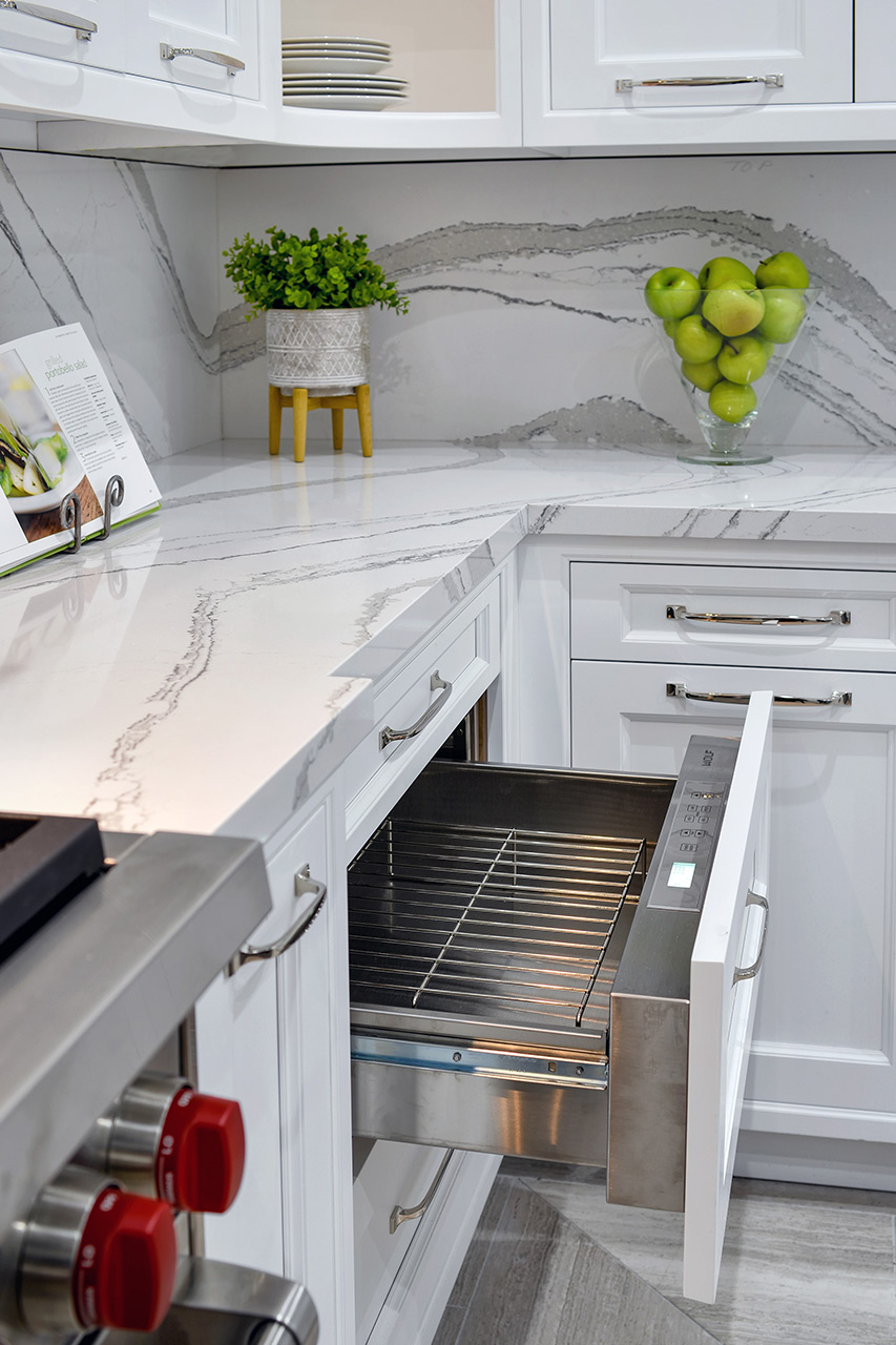 White Kitchen Cabinet - Opened integrated Warming Drawer panel