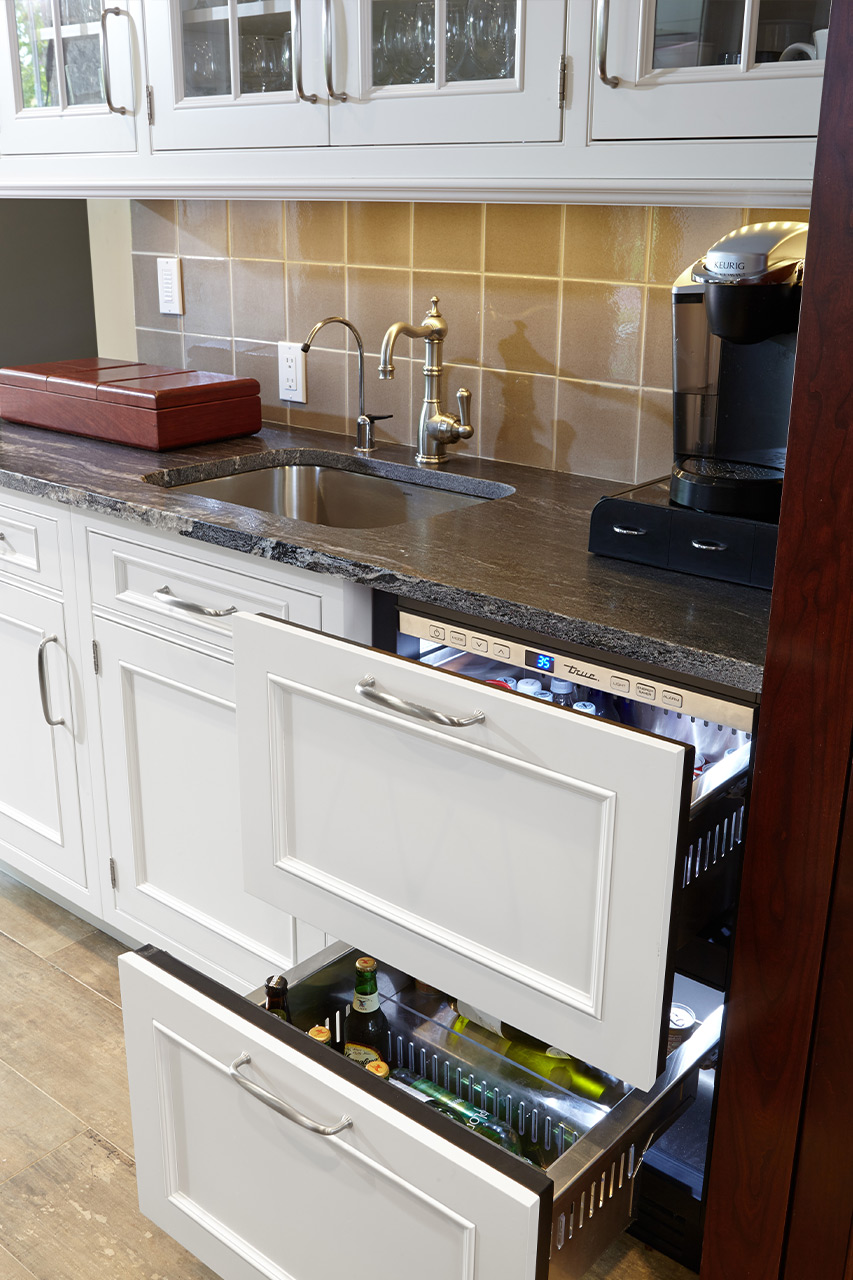 White Kitchen Cabinet - Opened integrated Fridge panel