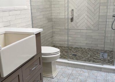 Grey Bathroom with Glass Door Shower and Vanity