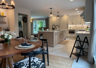 Wood grain melamine Kitchen Island, Compac Unique Countertop, Matte Black Hardware, ROHL Luxe Kitchen Faucet, Dinner Table