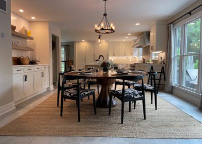 Wood grain melamine Kitchen Island, Compac Unique Countertop, Matte Black Hardware, ROHL Luxe Kitchen Faucet, Dinner Table, Hanging Lights