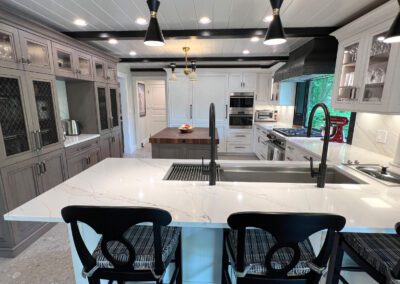 Full Center View - White Kitchen Cabinet, White Countertop., Wolf Range, Custom Coppersmith Black Painted Metal Hood