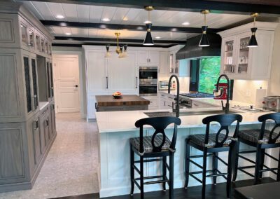 Center View - White Kitchen Cabinet, White Countertop., Wolf Range, Custom Coppersmith Black Painted Metal Hood