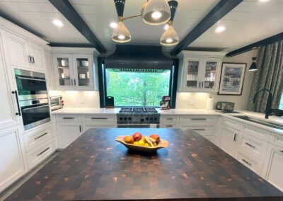 Window View - Wolf Gas Range, Coppersmith Metal Hood, Center Island white Kitchen