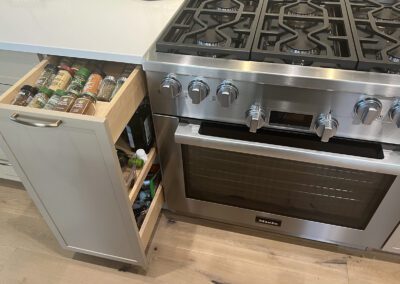 Palm Beach Kitchen on Luxury Lakefront with Golf course Views. SubZero wine refrigeration and built in spice drawer pull outs.